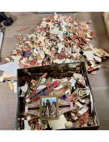 Large collection of old cigar bands and matchbox labels.