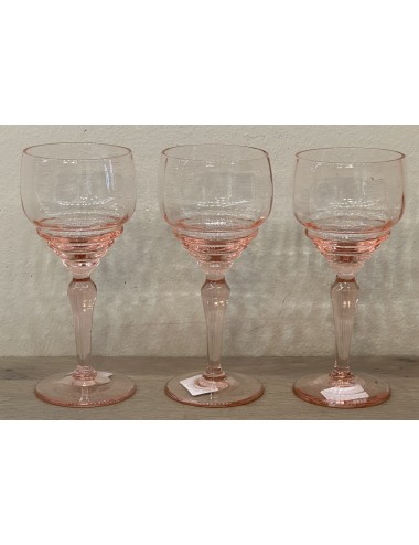 Glass on foot - pink colored with facet and 4 bulges under the chalice