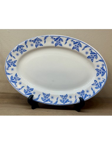 Plate - larger, oval, model - Boch - décor DUX executed in bright blue.