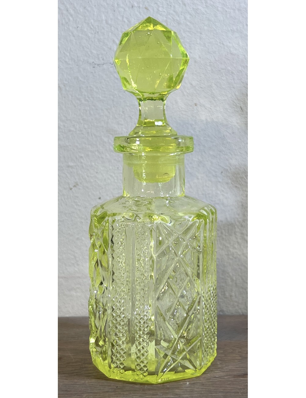 Perfume carafe with stopper - part of a dressing table set - executed in uranium glass/Annagreen glass