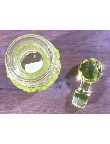 Perfume carafe with stopper - part of a dressing table set - executed in uranium glass/Annagreen glass