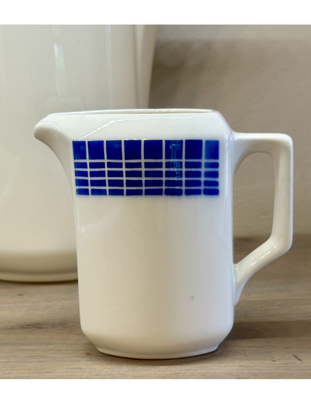 Milk jug - Théophile Fenal Badonviller - décor WAGRAM executed in blue