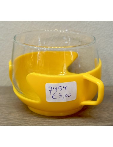 Tea glass in yellow coloured plastic holder - unmarked - 1970s