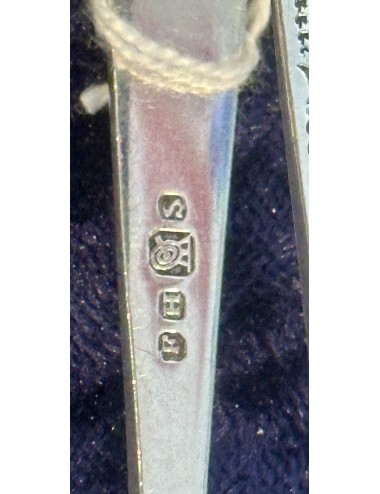 Sugar tongs - with silver markings