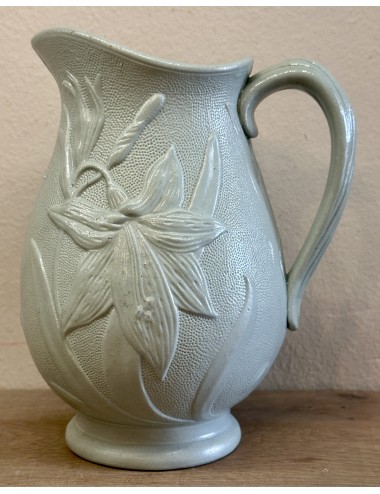 Jug / Wine jug - unmarked - décor of a flower (lily) in relief