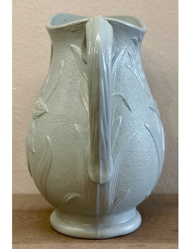 Jug / Wine jug - unmarked - décor of a flower (lily) in relief