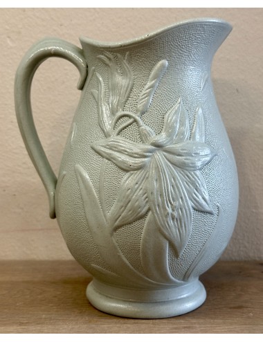 Jug / Wine jug - unmarked - décor of a flower (lily) in relief