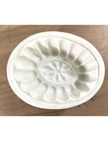 Pudding mould - large white porcelain model with oval flower shape incorporated in bottom