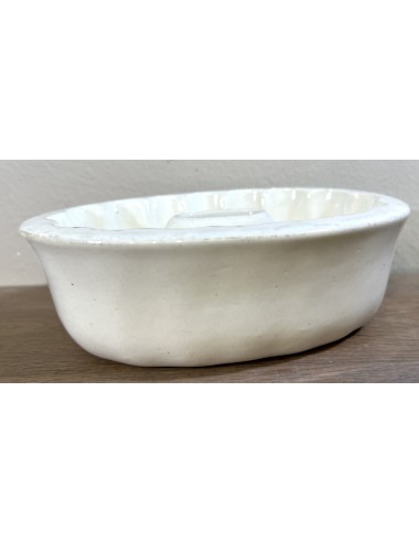 Pudding mould - white earthenware/porcelain model with open raised centre