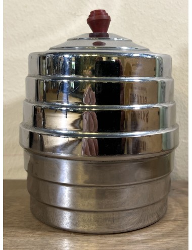 Storage jar executed in chrome with more red Bakelite lid knob