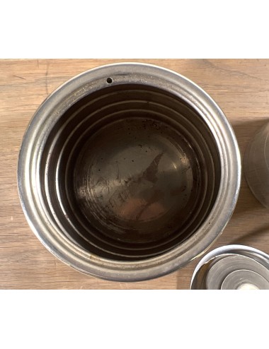 Storage jar executed in chrome with more red Bakelite lid knob